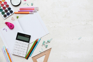 Wall Mural - Composition with blank copybook, different stationery and calculator on light background