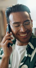 Poster - Man, phone call and joke at home with conversation and communication in living room with smile. Happy, funny male person and speaking with mobile and discussion in a house with talking for work