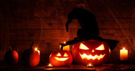 Wall Mural - halloween pumpkins on wooden background