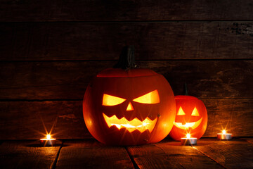 Wall Mural - halloween pumpkins on wooden background