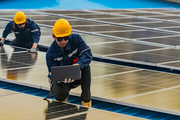 Worker Technicians are working to construct solar panels system on roof. Installing solar photovoltaic panel system. Men technicians walking on roof structure to check photovoltaic solar modules.