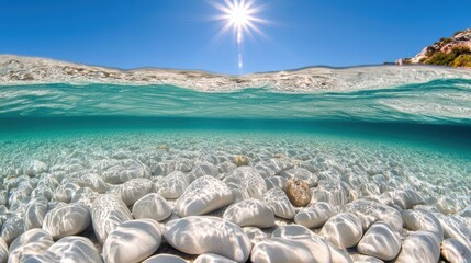 Sunlight creates beautiful reflections on clear water, illuminating smooth white stones and enhancing the underwater scenery