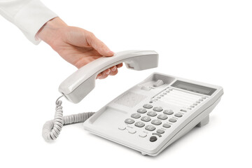 Woman taking handset of telephone on white background, closeup