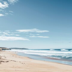 Wall Mural - Tranquil beach with white sand and blue water under a clear sky.