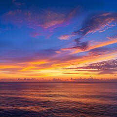 Poster - Vibrant orange and purple sunset over a calm ocean.