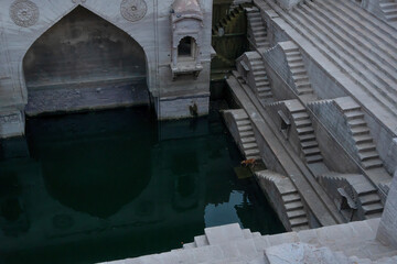 Wall Mural - Toorji's Step Well, Toorji ki Jhalara, Toorj ki jhalra, was built in 1740s.Hand carved step well bulit to provide water to the local people in the desert. Ancient architecture Jodhpur,Rajasthan,India.