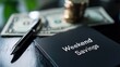 © Thanawat - Weekend savings concept with cash and pen Weekend savings concept featuring a black notebook labeled 'Weekend Savings,' a pen, and cash, symbolizing budgeting and financial planning
