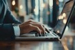 © Visual Odyssey - Closeup of businessman hand typing on laptop computer at office. Business man working on computer device, searching the information, surfing the internet on table at, Generative AI