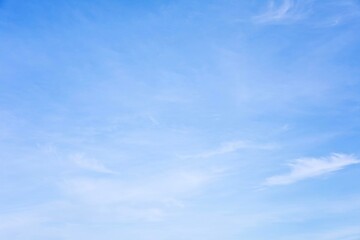Wall Mural - fantastic soft white clouds against blue sky and copy space horizontal shape