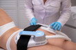 © FOTO_STOCKER - professional electrostimulation session, close up view o therapist applying EMS device on woman in modern clinic, muscle toning, body sculpting, fitness industry