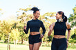 © peopleimages.com - Friends, girls and exercise with running at park in happiness for workout and jog in Atlanta. People, runner and smile or confident with fitness for health, wellness and self care on race in forest