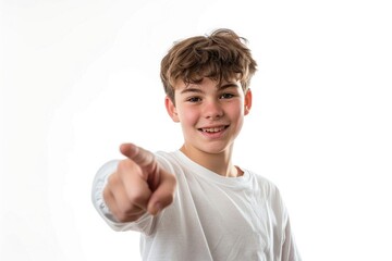 Poster - A young boy in a white shirt points at the camera, looking directly at the viewer