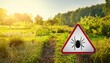 © Animaflora PicsStock - Warning sign beware of ticks in the garden