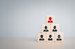 © RerF - Human resource management, HRM and recruitment business concept, Wood cube block with black and red businessman icon on top pyramid, Business build team. Pick a talented team leader from the crowd.