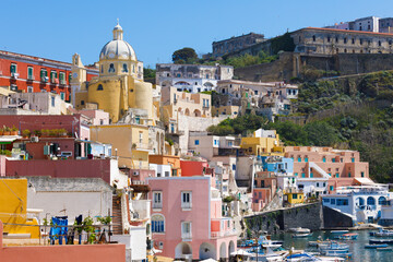 Wall Mural - Picturesque view of Santuario S. Maria delle Grazie Incoronata and colorful houses on Corricella in Procida, Italy. Procida Island located between Capo Miseno and Ischia island in Tyrrhenian sea