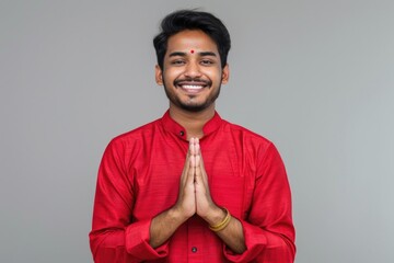 Poster - A person making a hand gesture while wearing a bright red shirt