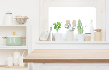 Wall Mural - Blank wooden table top part in blurred kitchen interior background