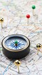 © pvl0707 - Planning your next adventure with a compass on a detailed map, noting various destinations marked with pins