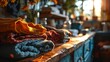 © Betti - Rustic kitchen bathed in warm sunlight with neatly folded clothes on a wooden counter creating a cozy and homey atmosphere.