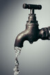© Phanthep - Old vintage faucet with flowing water