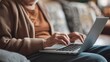 © Bubi Studio - Close-Up of Senior Individual Using Laptop for Online Course