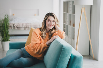 Sticker - Photo portrait of nice young girl sit couch relax dreamy wear orange clothes modern interior flat indoors