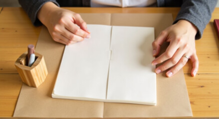 Wall Mural - close up of a person cutting a piece of paper