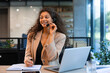 © ty - Beautiful smiling call center worker in headphones is working at modern office
