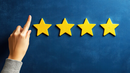 Hand pointing to yellow stars on a dark blue background, a concept of customer review and service experience with a positive rating for a customer satisfaction opinion poll