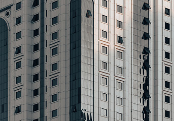 Wall Mural - many windows and walls facade of a modern skyscraper without people