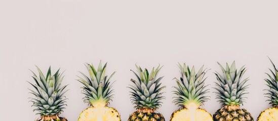 Aufkleber - Fresh pineapples arranged in a neat stack with a white background perfect for a copy space image