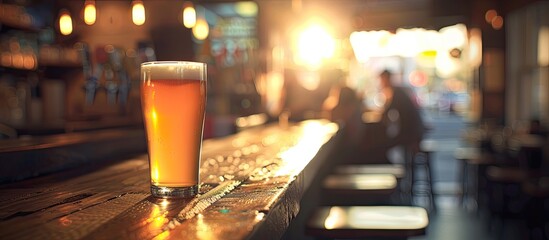 Poster - Fresh beer in a glass on a table at a pub with copy space image