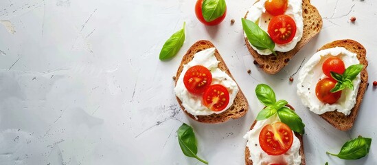 Aufkleber - Healthy breakfast recipe featuring rye toast with cream cheese tomatoes and basil captured in a top view copy space image