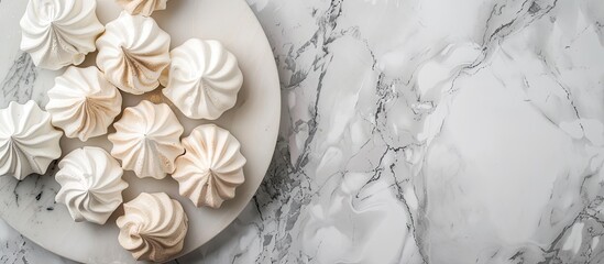 Aufkleber - Top view of a white marble table with a tray of delicious meringue cookies Ideal for adding text with copy space image