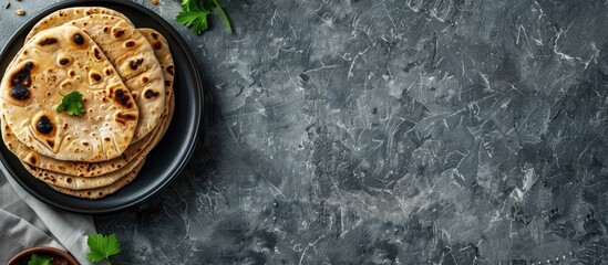 Poster - Indian chapati bread on gray backdrop highlighting vegetarian food with copy space image