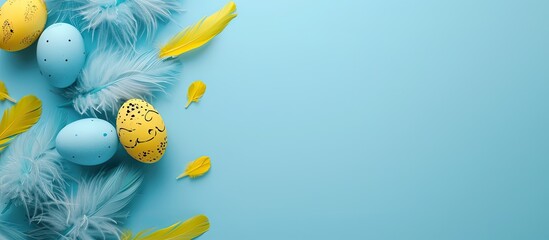 Aufkleber - Easter themed card featuring blue eggs yellow feathers and a light blue backdrop ready for your copy space image