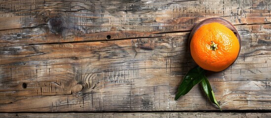 Wall Mural - Tangerine displayed on a wooden board with copy space image