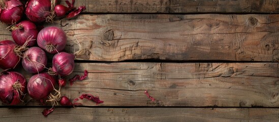 Poster - Rustic wood background with red onions offering copy space image