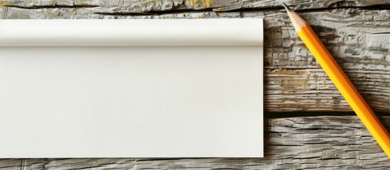 Aufkleber - Wooden table with pencil on blank notepaper offering copy space image
