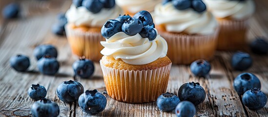 Aufkleber - Fresh cupcakes topped with ripe blueberries displayed on a rustic wooden surface with room for text in the image. Creative banner. Copyspace image