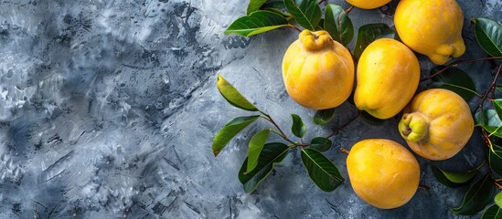 Aufkleber - Fresh organic quinces with leaves on a grey table top view perfect for adding text in the copy space image