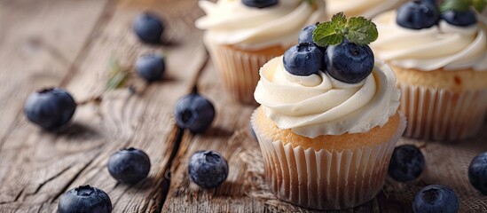 Aufkleber - Fresh cupcakes topped with ripe blueberries displayed on a rustic wooden surface with room for text in the image. Creative banner. Copyspace image