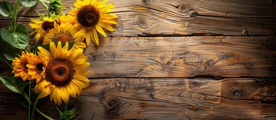 Wall Mural - Old wooden table with sunflower bouquet perfect for text on background Copy space image