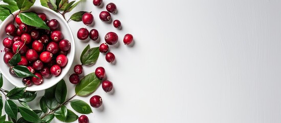 Sticker - White table displaying dried cranberries green leaves and ample copy space image