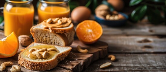 Poster - Homemade peanut butter on toast fresh orange juice on a wooden table in side view with copy space image for breakfast or brunch