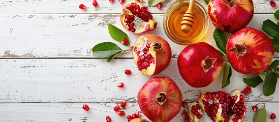 Aufkleber - Traditional Rosh Hashanah items like apples pomegranates and honey are displayed on a white wooden surface in a banner style image symbolizing the Jewish holiday with copy space
