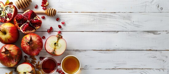 Aufkleber - Traditional Rosh Hashanah items like apples pomegranates and honey are displayed on a white wooden surface in a banner style image symbolizing the Jewish holiday with copy space