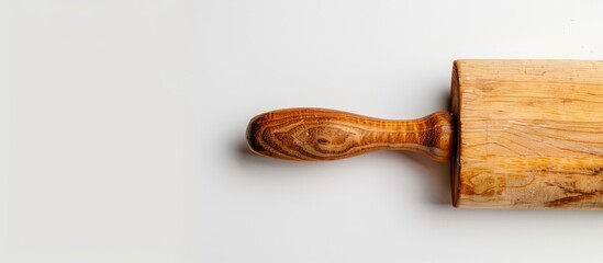 Poster - Wooden rolling pin on a white background with space for text or graphics in the image. Creative banner. Copyspace image