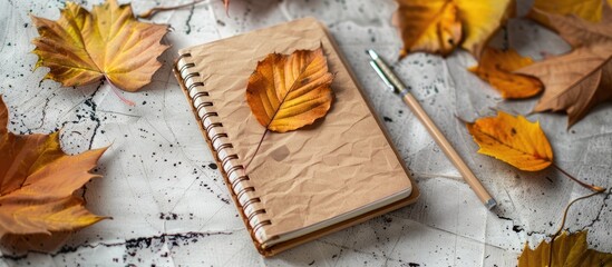 image of notebook with an autumn theme. with copy space image. Place for adding text or design