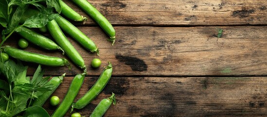 Aufkleber - Freshly peeled green peas on a brown wooden table with copy space Fresh green pea pods arranged in a horizontal composition isolated on an old rustic wooden surface with a soft focus